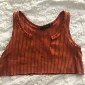 Extremely cropped burnt orange shirt
